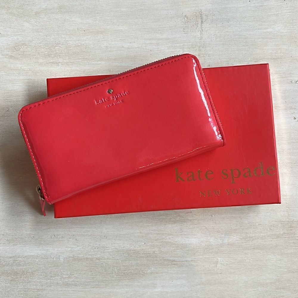 Kate spade Harrison Street zip around wallet in Carnelian (coral pink color)